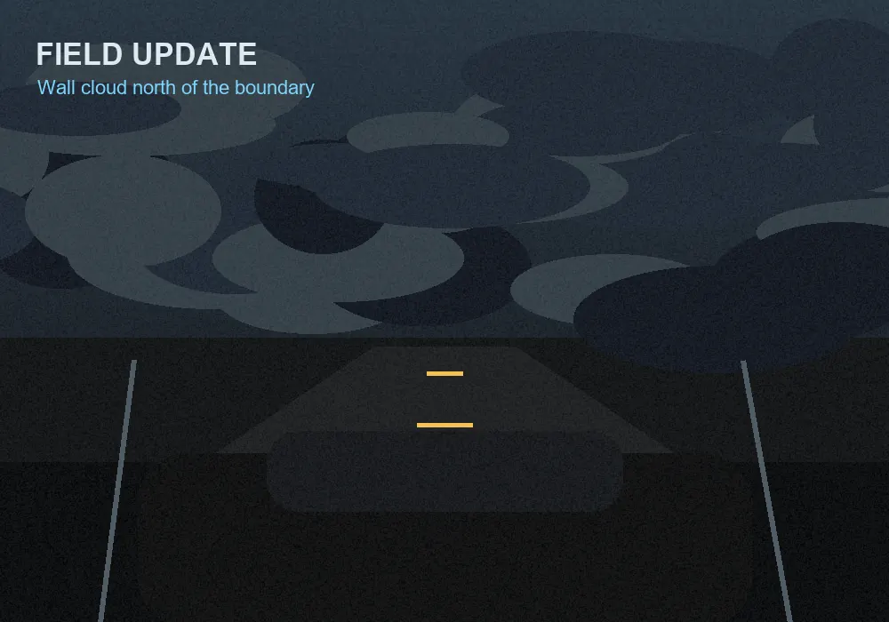 Storm chase road under a dark shelf cloud